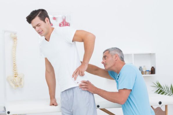 examination by a doctor for lower back pain