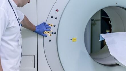 The doctor controls the MRI device